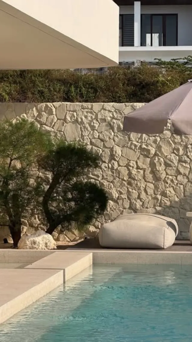 Reel: a villa pool and daybed