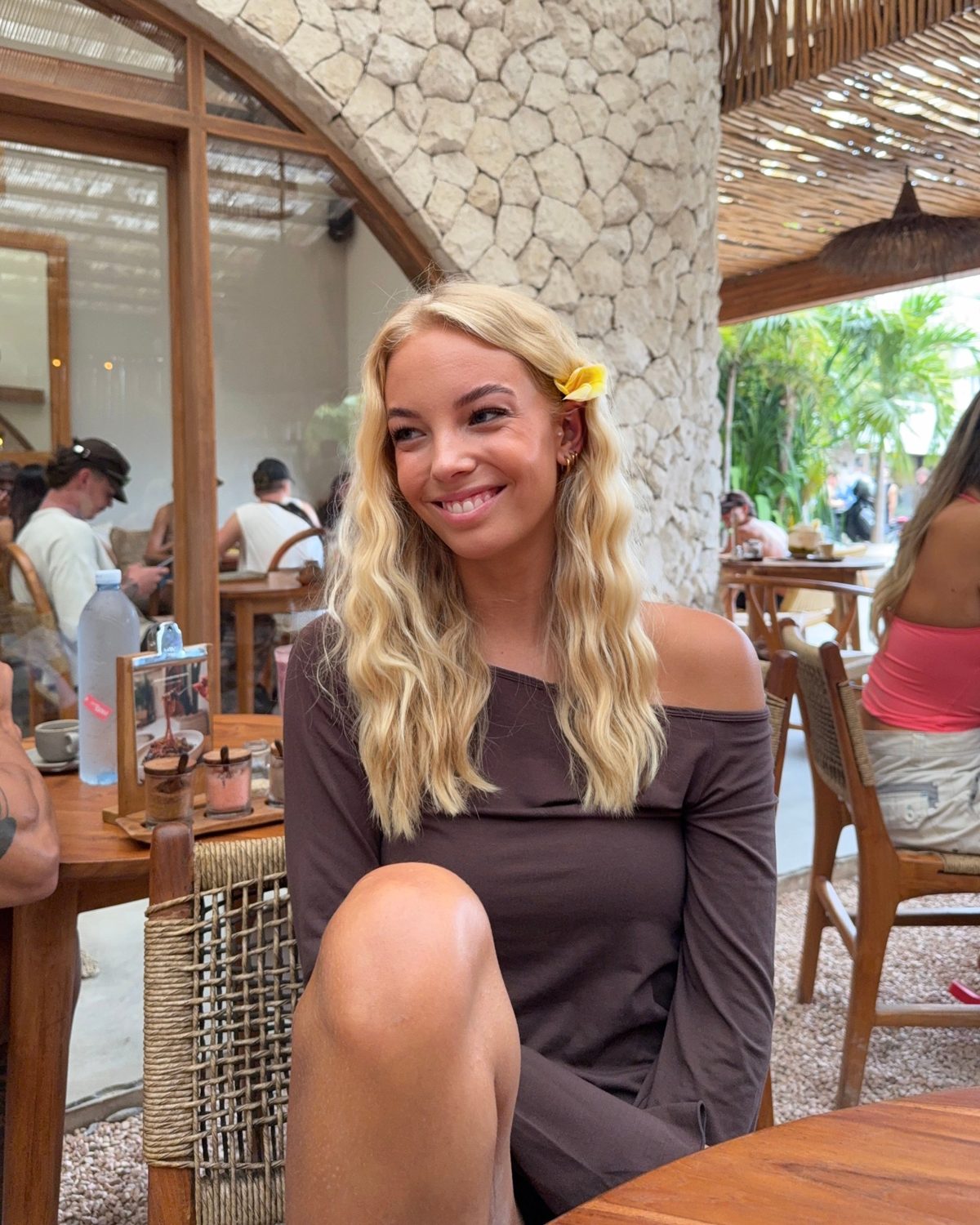 Lilli smiling in a café