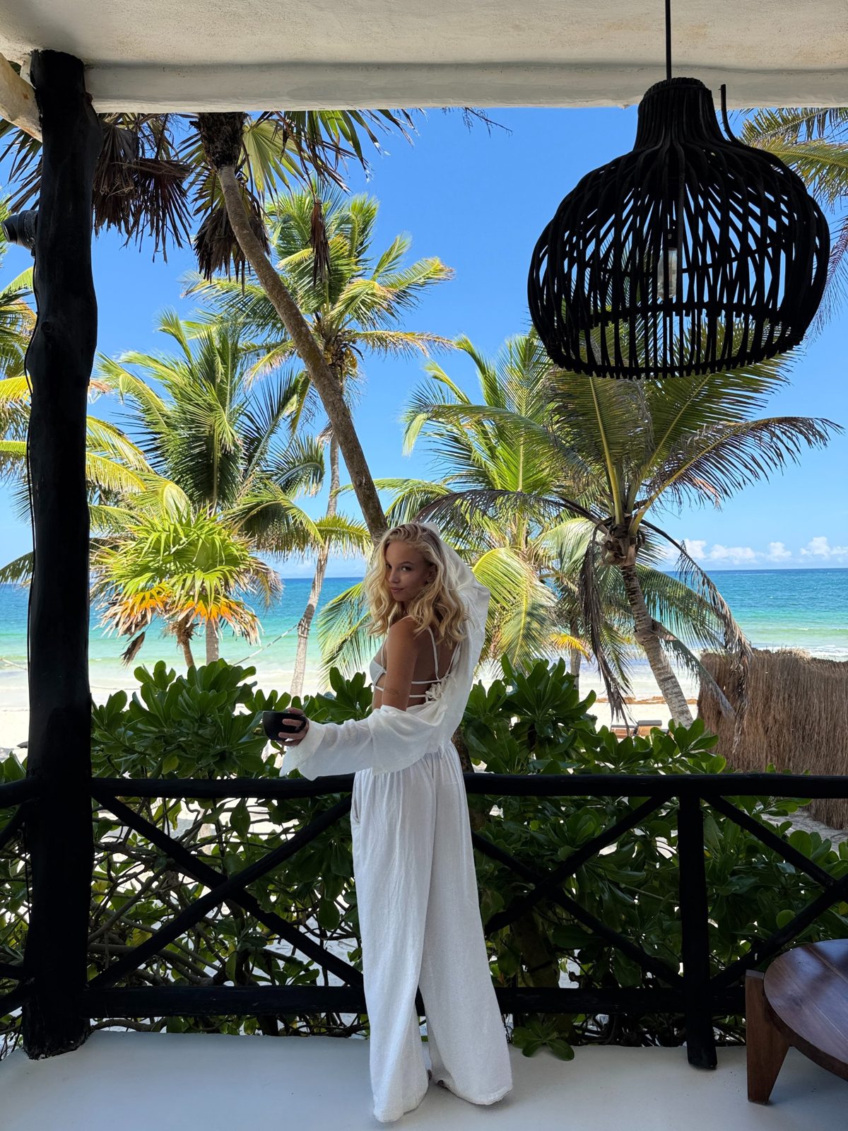Lilli on a terrace by the beach